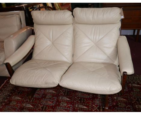 A 1960s Norwegian two seater sofa, by Soda Galvano, with cream leather upholstery, H.95cm L.134cm D.85cm, worn upholstery 