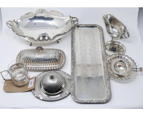 A collection of silver plated items, to include a dish with scalloped edge and twin scroll handles raised on four paw feet, a