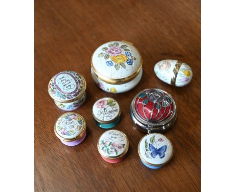 Four small Halcyon Days enamel pill-boxes, to/w two Crummles examples a similar unmarked Easter egg and a base metal box (8) 