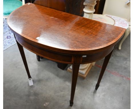 A 19th century walnut demi lune console table, crossbanded folding top with green baize lining on square tapering supports wi
