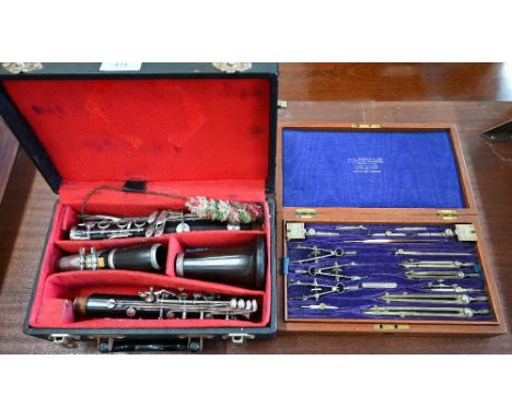 A vintage cased set of drawing instruments by W H Harling Ltd, London to/w a rosewood clarinet (2) 
