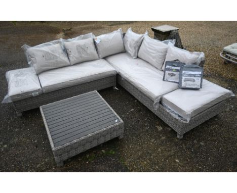 An unused (new ex stock) Kettler Palma faux rattan garden corner sofa, c/with all weather cushions and matching coffee table