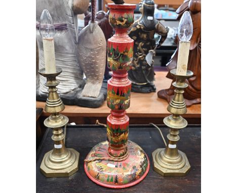 An Indian wood table lamp, painted with tigers hunting their prey 46 cm high to/w a pair of brass baluster candlesticks (conv