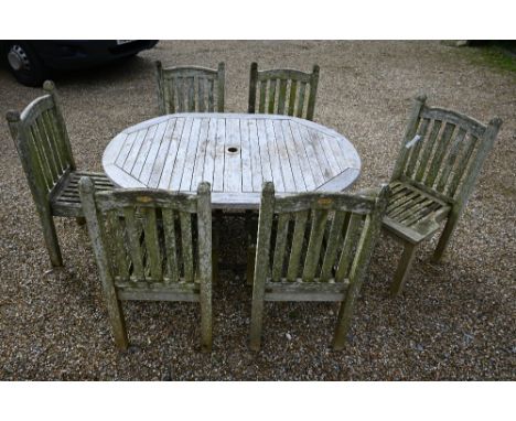 A folding teak garden table to/with a set of six 'Chic Teak' chairs (7) 