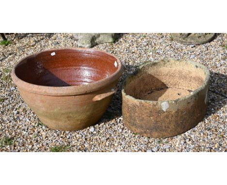 An old weathered oval stone planter to/w a circular glazed planter (2) 