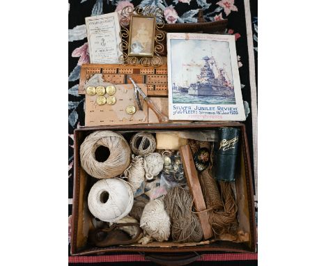 A small vintage suitcase containing a quantity of sail-mending equipment and yarns to/w Merchant Navy uniform buttons, 1934 L