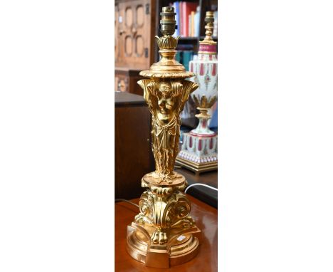 An ormolu lamp-base in the neo-classical taste, the pillar cast as the Three Graces, on scrolling plinth with lion-paw feet a