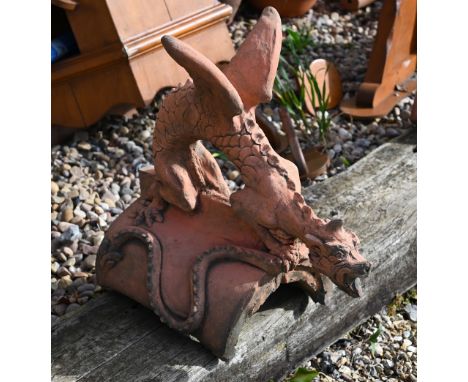 A cast terracotta dragon ridge tile 