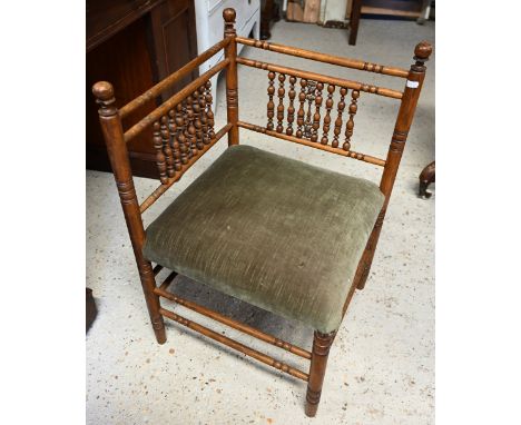 An antique bobbin turned corner chair, with fabric seat 