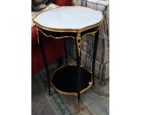 A Napoleon III style two-tier lamp table with simulated marble top and brass mounted ebonised base, 46 cm diam x 72 cm high 