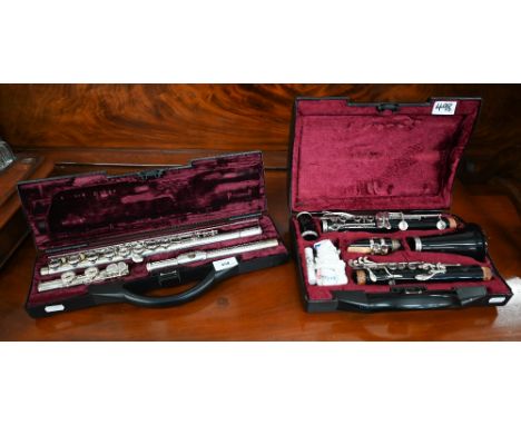A French Buffet flute (cased - little used), to/w a Buffet plastic clarinet (2) 