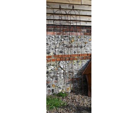 Pair of tall weathered steel arrow head obelisks (2) 