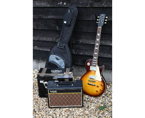 A 'Tokai Love Rock' Les Paul style electric guitar in 'CNB' soft gig-bag c/w a pathfinder 10 practice amplifier 