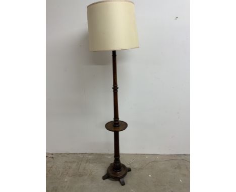 An oak standard lamp with dumb waiter W:30cm x D:30cm x H:170cm