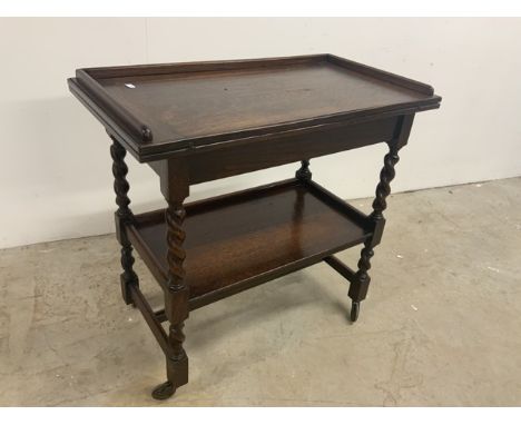 An oak swivel top card table with barley twist legs and lower shelfW:78cm x D:43cm x H:75cm