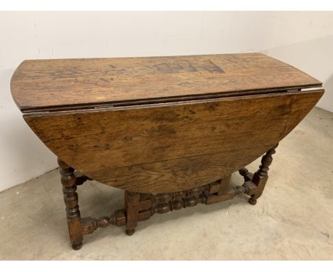 A Georgian oak gate leg tableW:120cm x D:48cm x H:74cm.           W:130cm x D:130cm x H:74cm.
