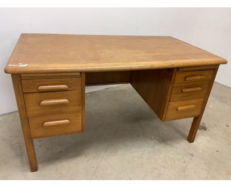 A light oak pedestal desk W:137cm x D:75cm x H:75cm