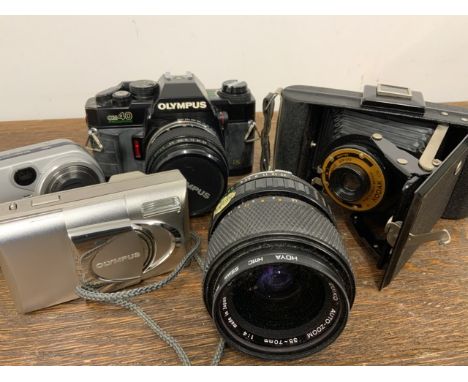 An Olympus camera and lens, Kodak Brownie camera etc