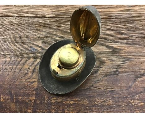A late 19th early 20th century novelty inkwell in the form of a Stetson hat with giltbrass and glass liner