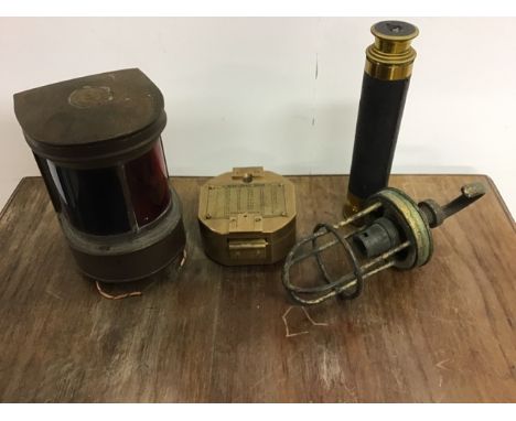 A collection of nautical related items to include a three drawer telescope, a brass compass and other items.
