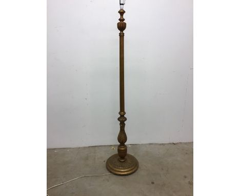 A gilt pedestal floor lamp on carved circular base. W:35cm x D:35cm x H:162cm