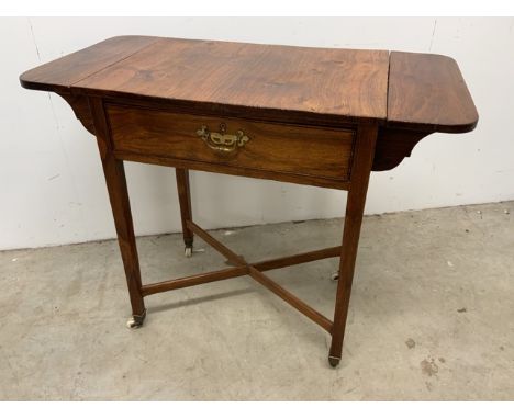 A early 20th century ladies drop leaf side table with cross stretchers and ceramic castorsW:89cm x D:45cm x H:74cm