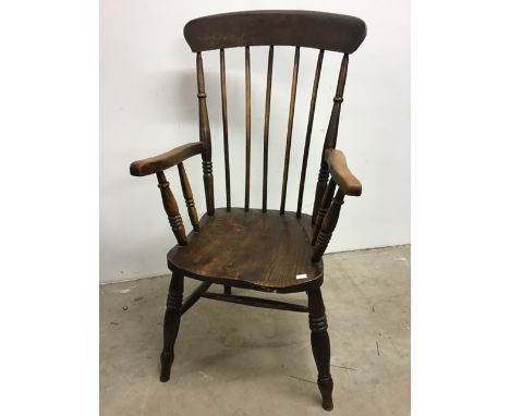 A late 18th early 19th century stick back Windsor chair