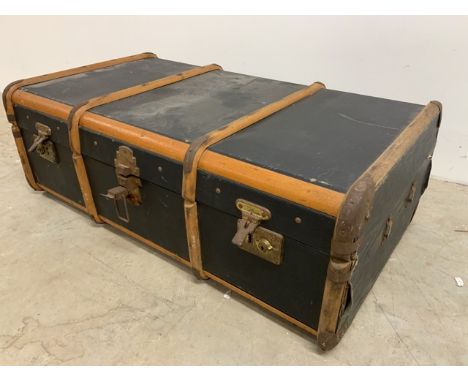 A travelling trunk, canvas and bent wood exterior with metal bound edgesW:92cm x D:54cm x H:30cm