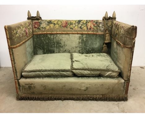 A late 19th early 20th century Parker Knoll style two seater drop arm sofa in period green velvet upholstery with needlework 