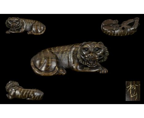 A Japanese Carved Boxwood Netsuke In The Form Of A Tiger. Finely Carved - Signed To Base. Please See Accompanying Image. 