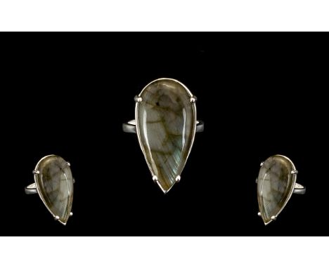 Labradorite Pear Cut Solitaire Ring, an elongated pear cut 24ct cabochon of labradorite, the natural, moody stone with the in