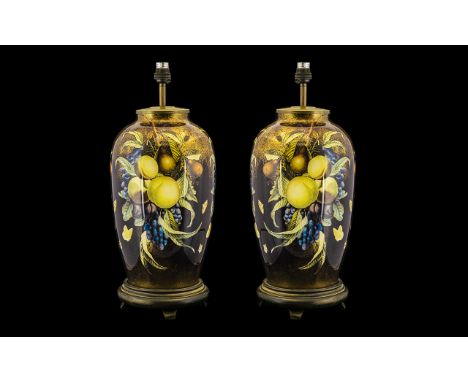 Two Large Lamp Bases each approx 20" tall, coloured solid glass lamps decorated with fruit design and raised on wooden bases.