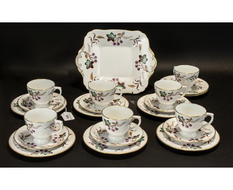 Spode Porcelain Tea Set comprising seven cups; six saucers; seven side plates and a large sandwich/cake plate.  White ground 