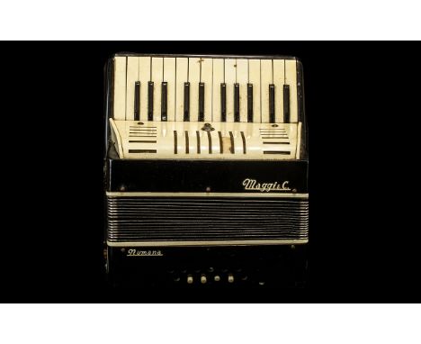 Vintage Piano Accordian by Maggi & Co.  Black and white colour with tan shoulder strap.  Please see images.