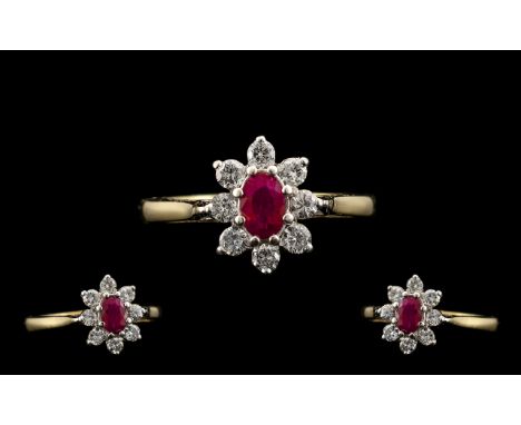 18ct Gold and Attractive Petite Ruby and Diamond Set Dress Ring with flower head design/setting. Full hallmark for 18ct. The 
