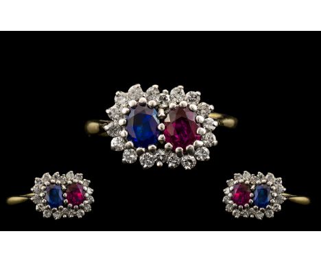 18ct Two Tone Gold Ruby Blue Sapphire and Diamond Set Dress Ring of pleasing design. The ruby and sapphire surrounded by 20 d