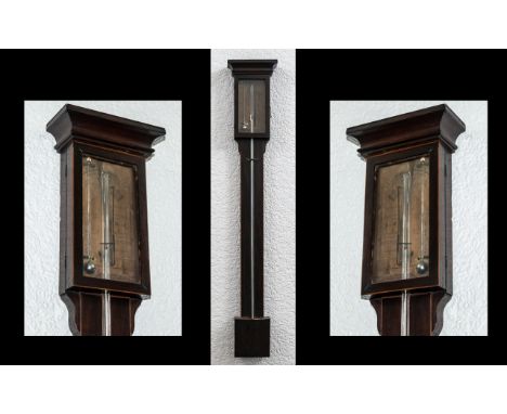 A Georgian Antique Mahogany Stick Barometer - with glazed exposed door with paper label. Maker Barnas &amp; Co Newcastle. Wit