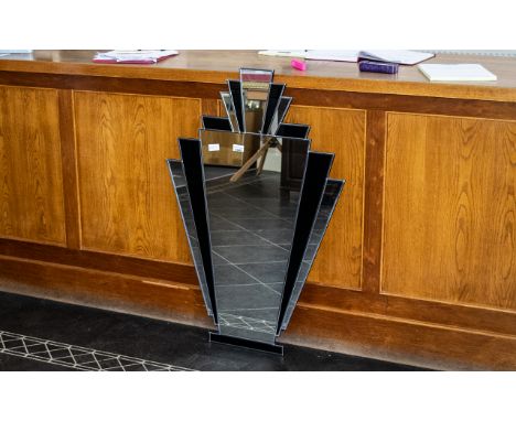 Art Deco Style Mirror.  Vintage style Art Deco wall mirror in fan shape with black and mirrored inserts.  Measures 39" x 26" 