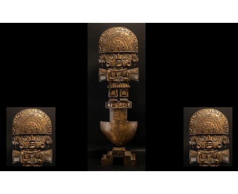 A Large Carved Peruvian Totem depicting an Aztec god fitted on a step base 36 inches high.