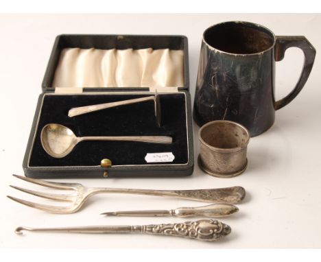 A collection of hallmarked silverware, to include a tankard, a boxed child's spoon and pusher set, napkin ring, fork, button 