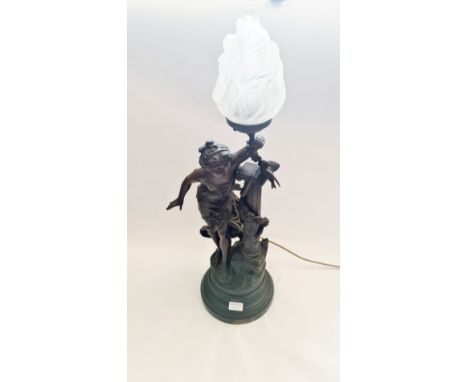 A spelter lamp with female figure base.