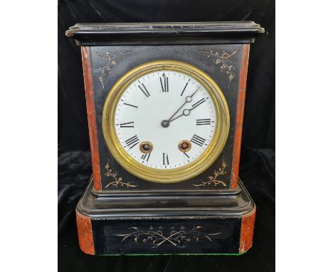 A black slate and red marble mantle clock with gold leaf floral design.approx 34cm.