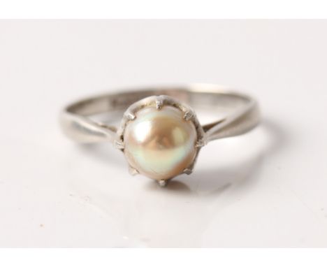 A pearl set ring, stamped platinum, ring size G1/2.