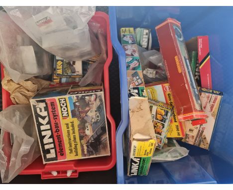 Two boxes of model train accessories.