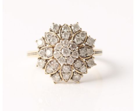 A diamond cluster ring, the flower head design set with round brilliant cut diamonds, total diamond weight approx. 1ct, unmar