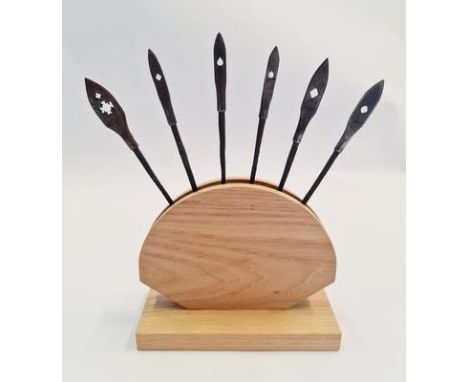 Six Japanese samurai Yanone arrow heads in wood stand.