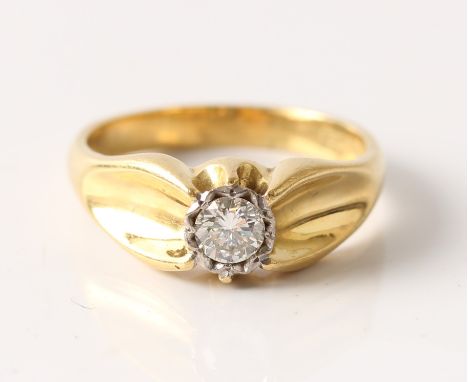 A hallmarked 18ct yellow gold solitaire diamond ring, set with a round brilliant cut diamond, measuring approx. 0.33ct, to sh