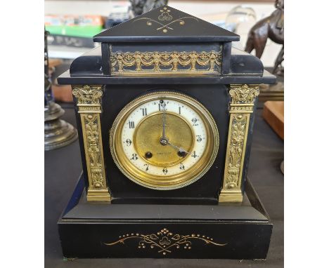 A black slate architectural style mantle clock.