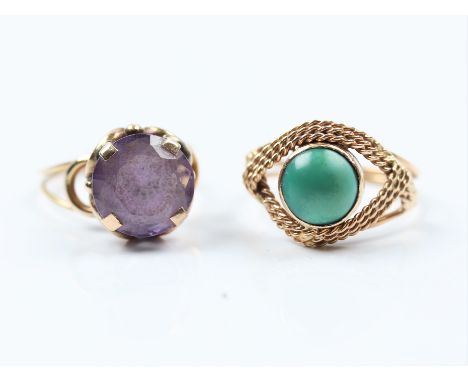 A reconstituted turquoise single stone ring together with an amethyst single stone ring, both indistinctly stamped, ring size
