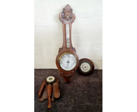A mercury oak barometer brush set with a round barometer.
